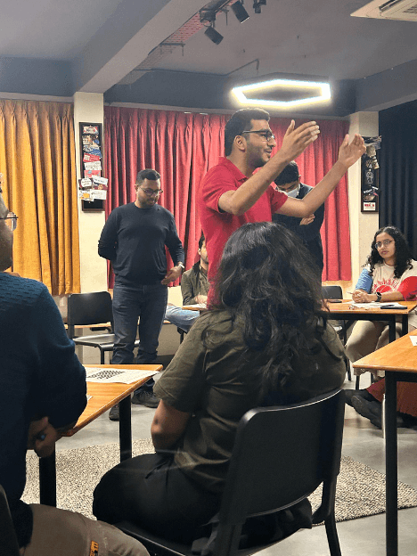 Audience participating in a Varun Gwalani event