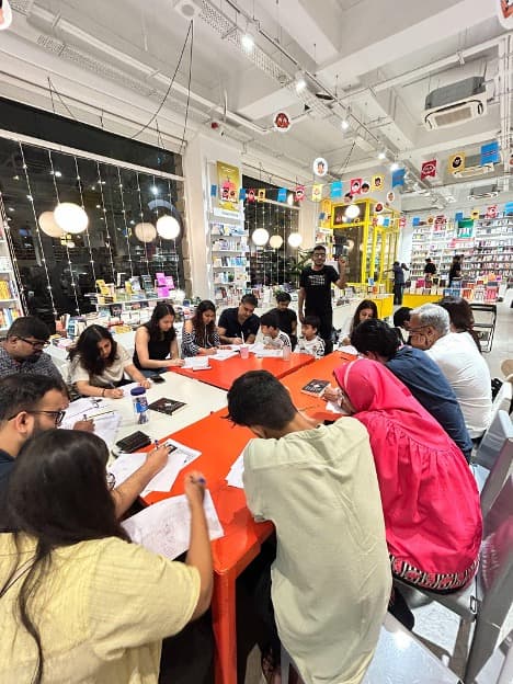 Participants seated around tables at a Varun Gwalani event