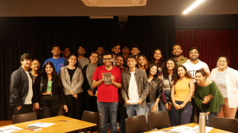 Group photo from a Varun Gwalani event in an auditorium
